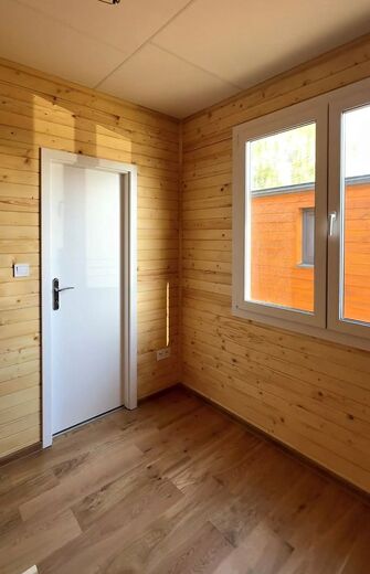 Bedroom in a Mobile Home with Wooden Panelling