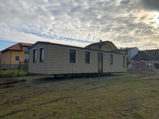 Mobile Home with Brown Windows and Roof