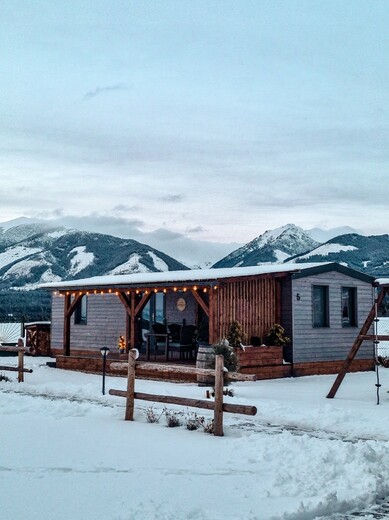 Mobile Home Exterior – Grey Wood Facade in Winter Landscape