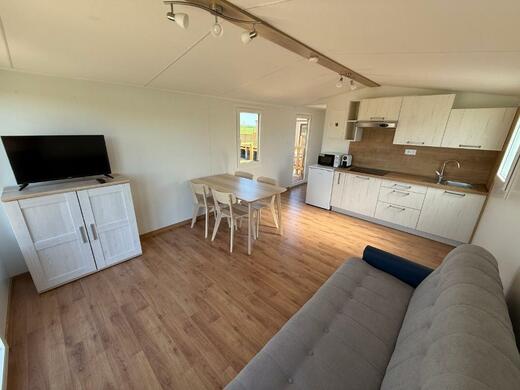 Living room with kitchen in mobile home | Spacious interior